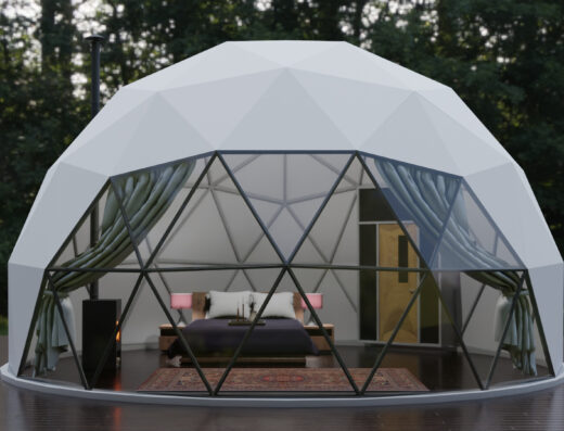 A white dome with a bed inside of it.